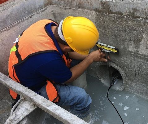 Open channel doppler wall-mounted ultrasonic flow measurement devices